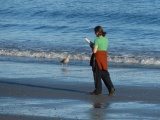 Strangers Passing on the Beach