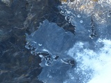 Melting Ice over Stream
