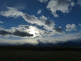 Sun and Clouds in Blue Sky