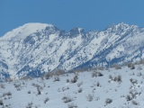 Mountain Crags over Snowy Hill