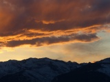 Bright Clouds over Dark Mountains