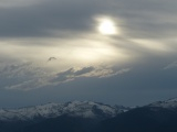 Sun, Clouds and Mountain Range