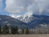 Fluffy Clouds over the Mountains