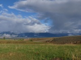 Grass, Mountains, and Clouds