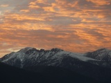 Snowy Mountains under Peach Sky