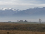 Houses in a Misty Valley