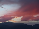 Maroon Clouds over Mountains