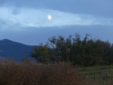 Rising Moon in a Band of Sky