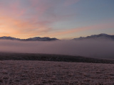 Icy Ground under Dawn Clouds