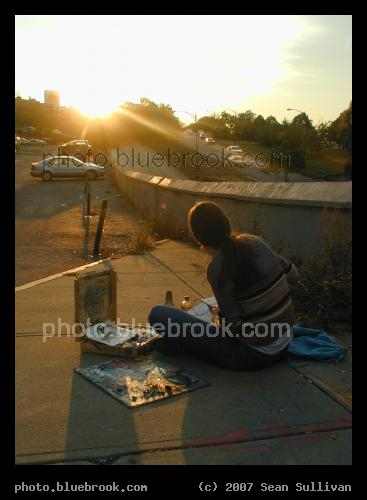Painting on Mass Ave - Woman painting at sunset along Massachusetts Ave, Boston MA