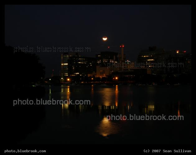 East Cambridge Eclipse - A partial eclipse of the moon, near moonset, looking over the Charles River towards East Cambridge MA