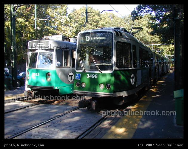 Green Line Pair - Two trains on the MBTA Green Line at Longwood station (Brookline MA).  On the left, an outbound Type 7 LRV; on the right, an inbound Boeing LRV.