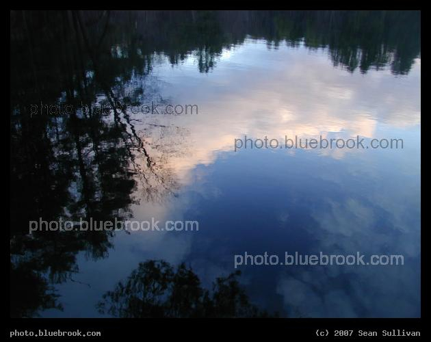 New Hampshire Reflection - Clouds and trees reflected in a lake, Amherst NH