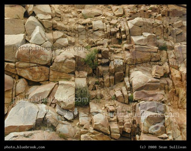 World Turned Sideways - A rock face beside a road through Rocky Mountain National Park in Colorado, with layers showing that the rock has rotated sideways from its original orientation