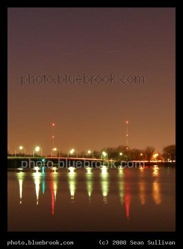 Undocking - Two spacecraft, the International Space Station and space shuttle Endeavour (STS-126), passing over the Mystic River and Wellington Bridge (Somerville/Medford MA).  The moving spacecraft appear as streaks of light flanking the bright star Alioth in this 4-second exposure.