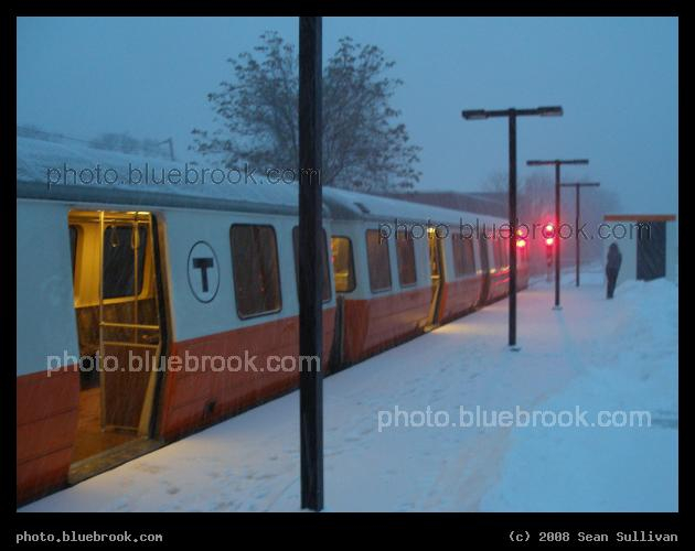Snow at Oak Grove - An MBTA Orange Line subway train at Oak Grove station, Malden MA