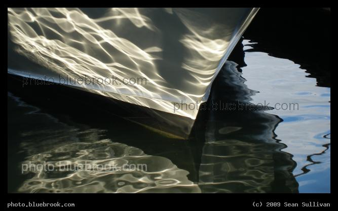 Silver Ripples - The afternoon sun reflecting onto a boat at Rowes Wharf, Boston MA