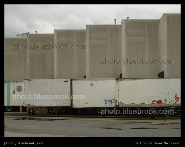 Deliveries - Trucks lined up at a shopping plaza loading dock, Jersey City NJ