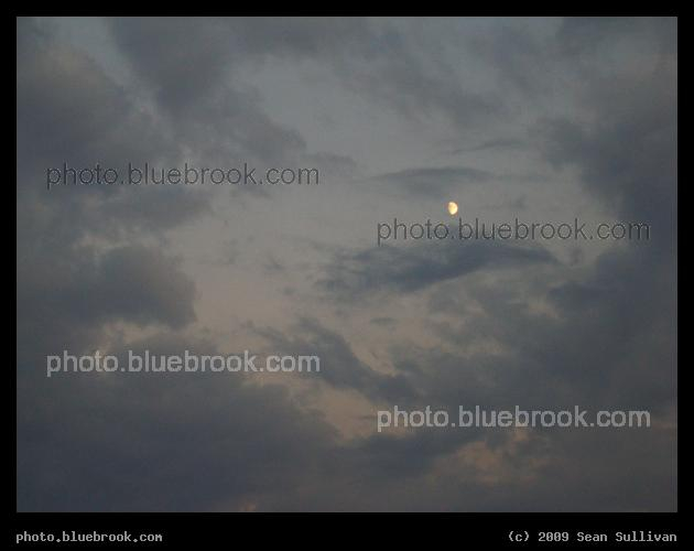 Gibbous among the Clouds - A waxing gibbous moon in evening twilight, Boston MA