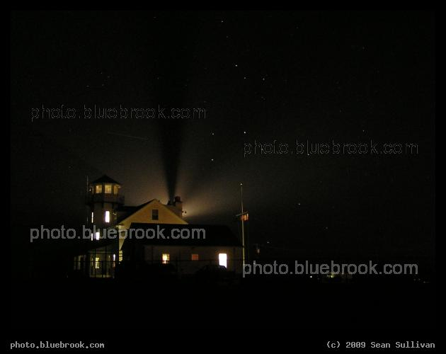 A Lighthouse and the Stars - The Point Judith Lighthouse (Narragansett RI) illuminates a starry sky, with the constellation Sagittarius setting beside the lighthouse
