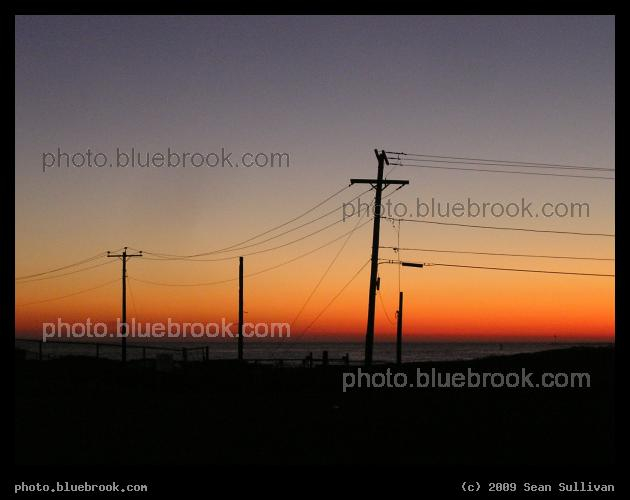Narragansett Sunset - Wires silhouetted against the colors of evening twilight, with the Atlantic Ocean in the background, Narragansett RI