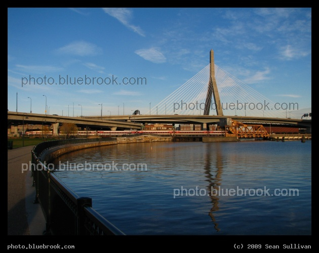 North Point Waterfront - The Charles River, Zakim Bridge and an outbound MBTA commuter rail train, as seen from North Point Park, Charlestown MA