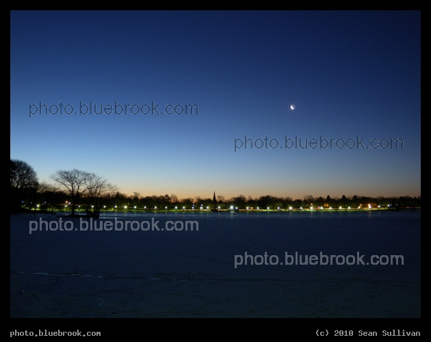Predawn Vista - The waning crescent moon in early morning twilight over Jamaica Pond, Jamaica Plain MA