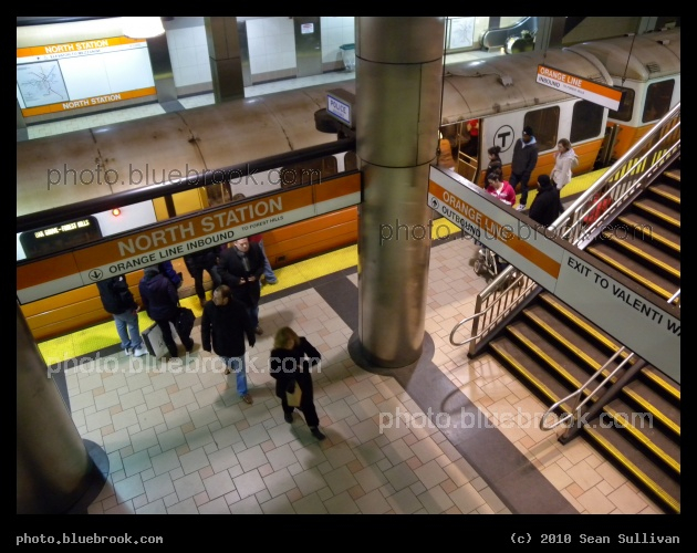 Exit to Valenti Way - An inbound MBTA Orange Line train at North Station, Boston MA