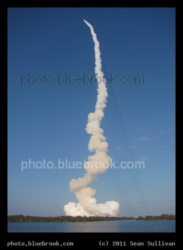 Shuttle Ascent - Space shuttle Discovery on its final launch (mission STS-133) as seen from the Kennedy Space Center press site