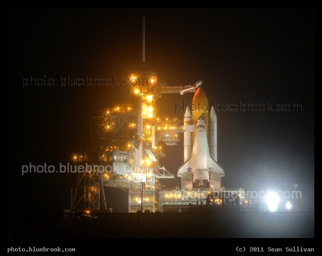 Discovery Unveiled - Space shuttle Discovery at Kennedy Space Center launch pad 39-A on the night before its final flight