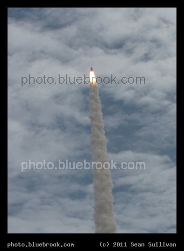 Through the Clouds - The final space shuttle launch, Atlantis on mission STS-135, from the Kennedy Space Center press site