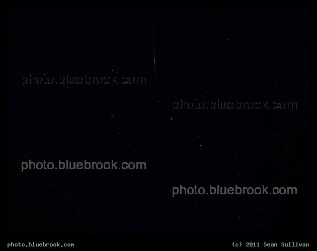 UARS Flare - The Upper Atmospheric Research Satellite (UARS) visible in orbit, reflecting sunlight during a time exposure, and producing a bright flare.  Photograph from Crookston MN during August 2011, seven weeks before the satellite falls back to Earth.