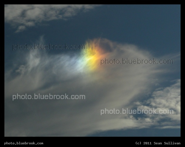 A Touch of Rainbow - A small afternoon sundog appearing on a cloud, Portland ME