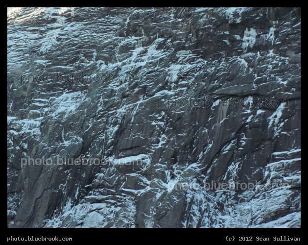 Highlighted in Snow - A rock face in the White Mountains near Franconia Notch, New Hampshire