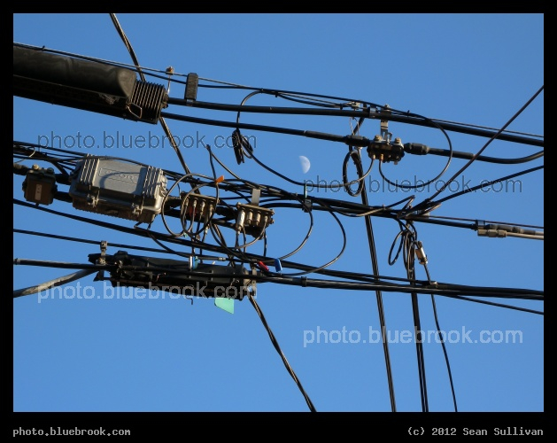 Technology and Sky - A view of the moon through overhead electrical wires, Newton MA
