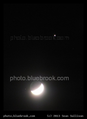 Moons and Jupiter - The crescent moon with Jupiter.  Two of Jupiter
