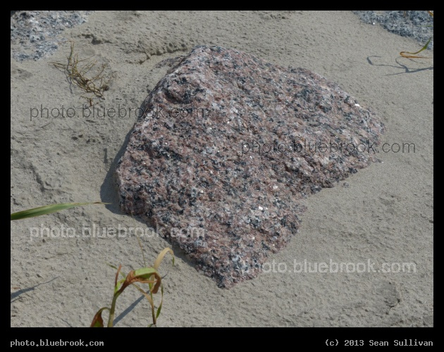 Granite in Sand - A rock in the dike along the Red Lake River, Crookston MN