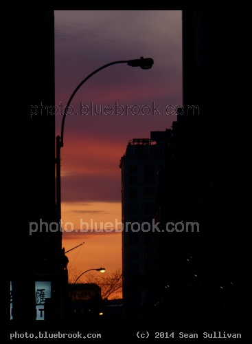 Vivid Sky under Streetlamp - Sunset in a section of sky between buildings, New York City