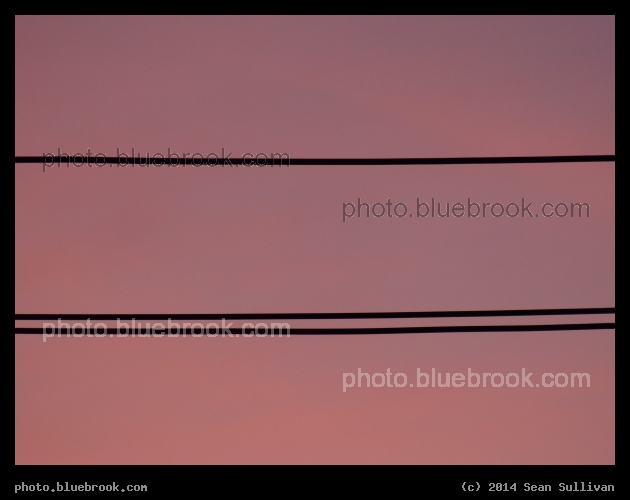 One Line, Two Lines - Silhouette of utility wires against a sunset sky, Somerville MA