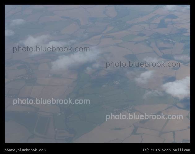 Farmland and Clouds - Airplane view over England