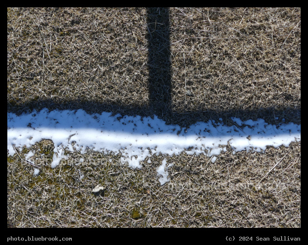 Shadow Effects - Snow remaining only in the area shadowed from the midday sun, Corvallis MT