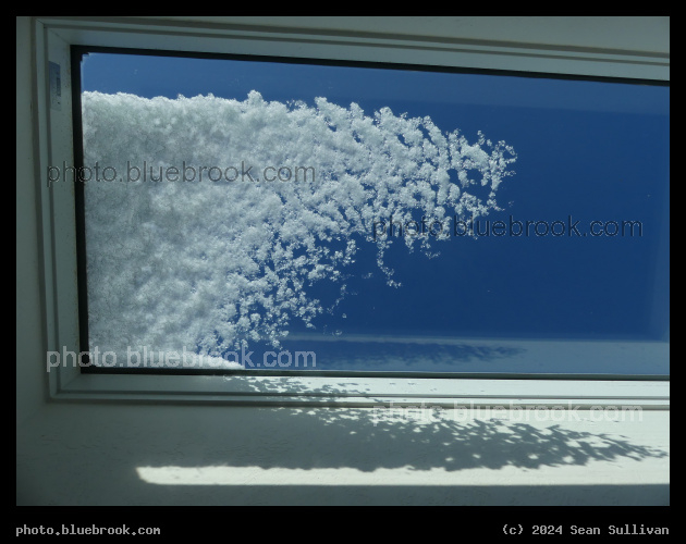 Wave of Snow - Snow on a skylight, Corvallis MT